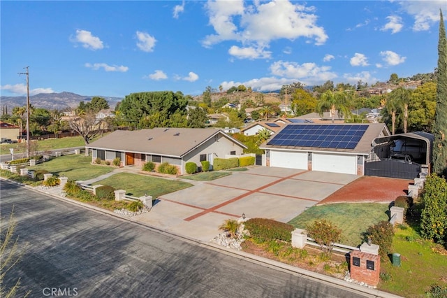 drone / aerial view with a residential view and a mountain view