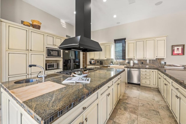 kitchen featuring stainless steel appliances, island range hood, and cream cabinets