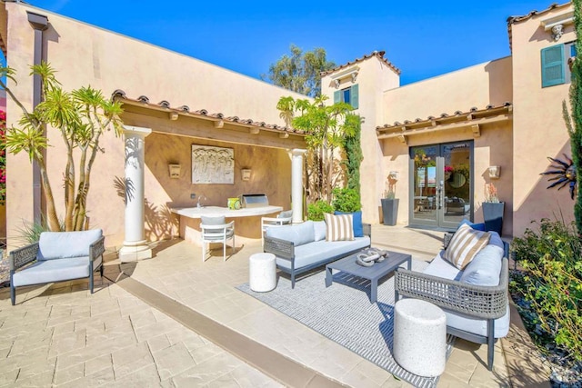 view of patio / terrace with french doors and an outdoor hangout area