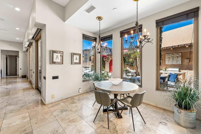 dining room featuring baseboards, visible vents, a chandelier, and recessed lighting