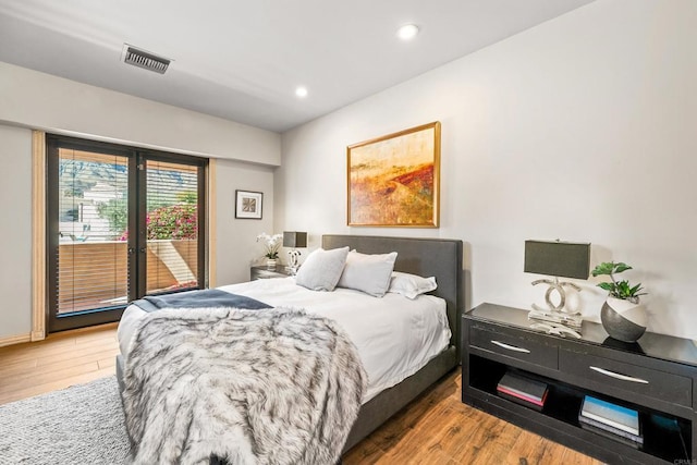 bedroom featuring recessed lighting, light wood-type flooring, visible vents, and access to exterior