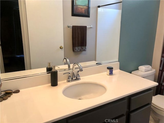 bathroom with vanity and toilet