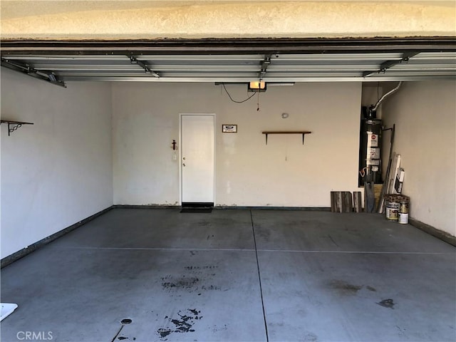 garage with secured water heater and baseboards