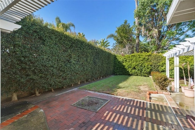 exterior space featuring a patio, a fenced backyard, and a pergola