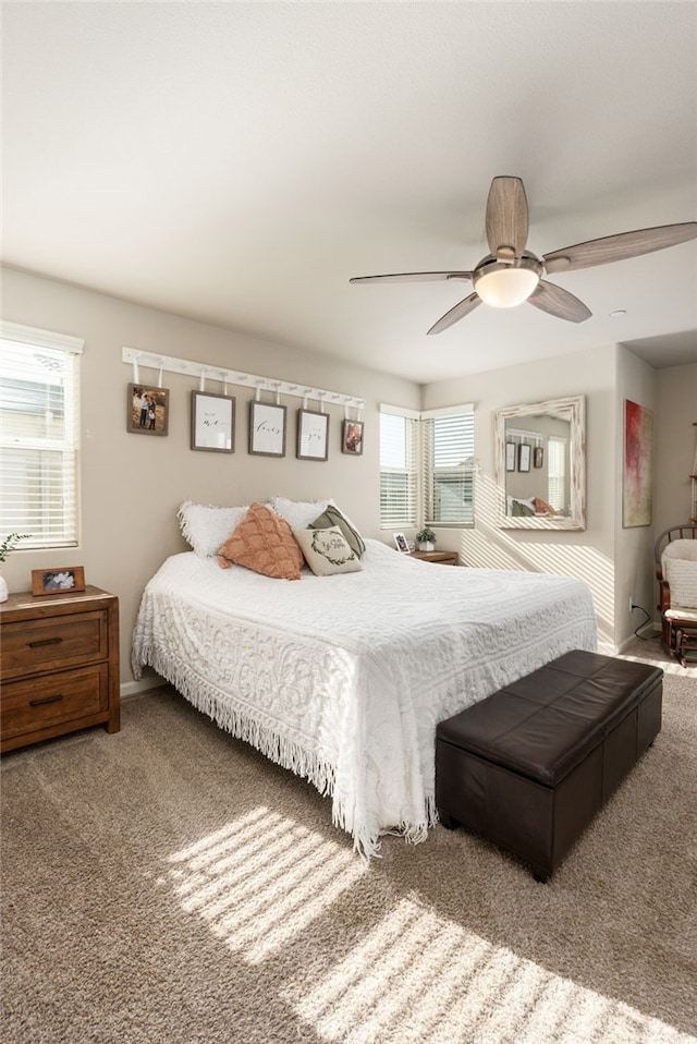 bedroom with baseboards, a ceiling fan, and carpet flooring