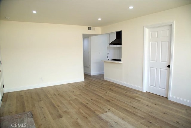 3659 W 110th St, Inglewood, CA 90303 - unfurnished living room with recessed lighting, visible vents, baseboards, and light wood finished floors