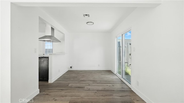 3659 W 110th St, Inglewood, CA 90303 - unfurnished dining area featuring wood finished floors and baseboards