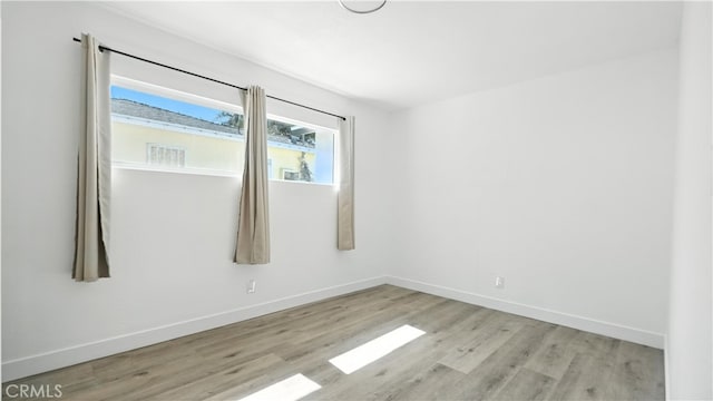 3659 W 110th St, Inglewood, CA 90303 - empty room with wood finished floors and baseboards