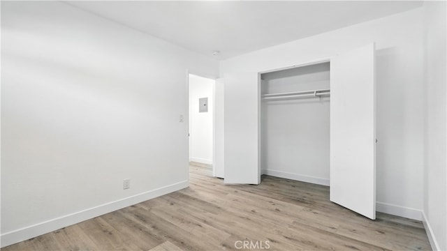 3659 W 110th St, Inglewood, CA 90303 - unfurnished bedroom with wood finished floors and a closet
