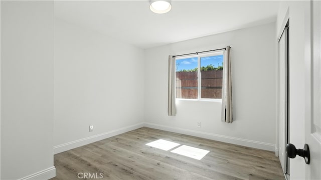3659 W 110th St, Inglewood, CA 90303 - unfurnished bedroom featuring wood finished floors and baseboards