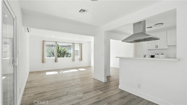 3659 W 110th St, Inglewood, CA 90303 - unfurnished living room featuring light wood finished floors and baseboards
