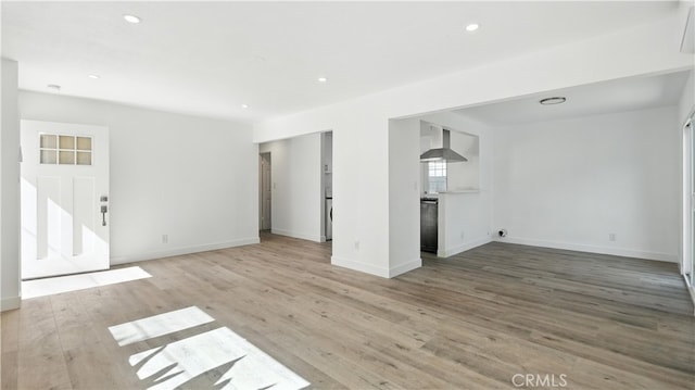 3659 W 110th St, Inglewood, CA 90303 - unfurnished living room with light wood finished floors and recessed lighting