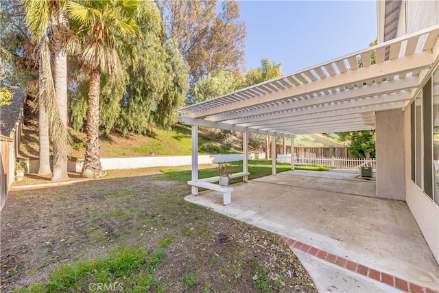 view of yard with a patio area, fence, and a pergola