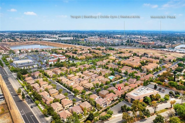 birds eye view of property featuring a water view and a residential view