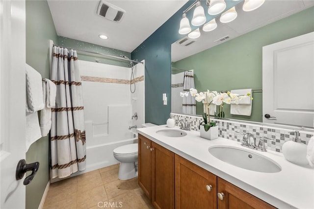 bathroom with visible vents, a sink, and toilet