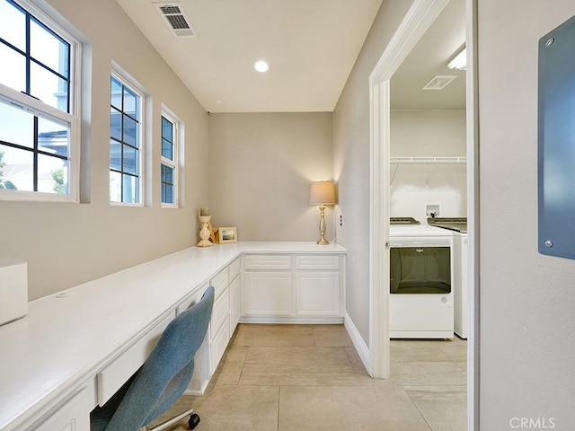 office with washing machine and dryer, visible vents, and light tile patterned floors