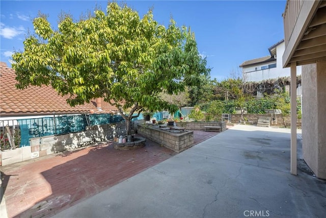 view of patio / terrace featuring fence