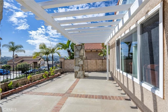 view of patio / terrace with a fenced backyard and a pergola