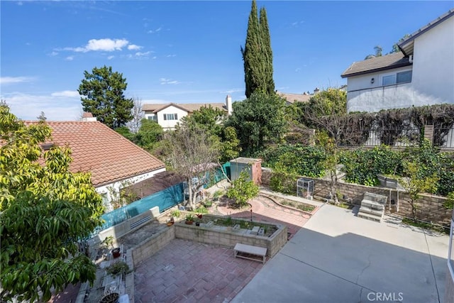 view of patio featuring fence