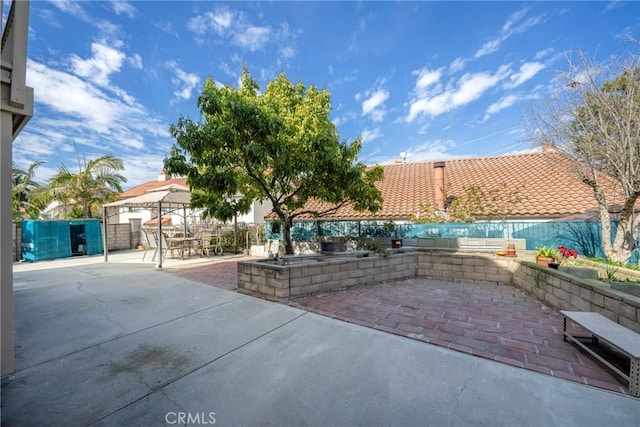 view of patio / terrace featuring a gazebo and fence