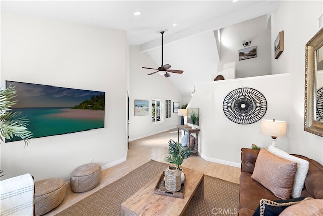 living area with high vaulted ceiling, baseboards, beam ceiling, and wood finished floors