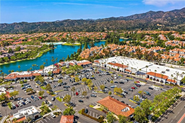 birds eye view of property featuring a water and mountain view