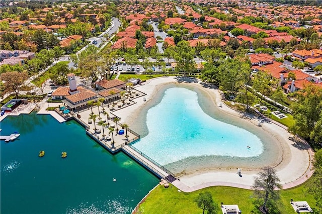 drone / aerial view featuring a water view and a residential view