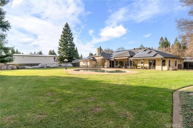 view of yard with a fenced backyard, a fenced in pool, and a patio