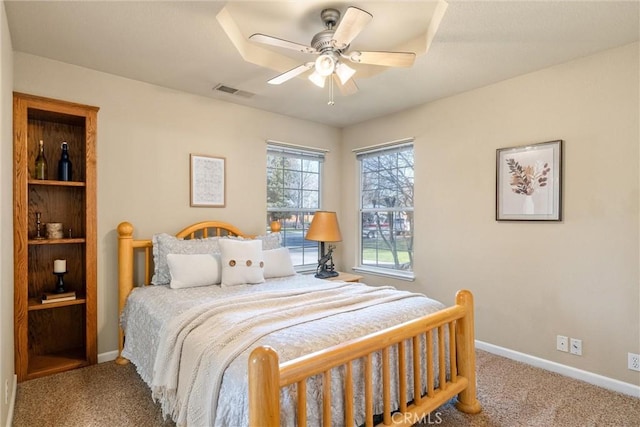 bedroom featuring visible vents, baseboards, a ceiling fan, and light colored carpet