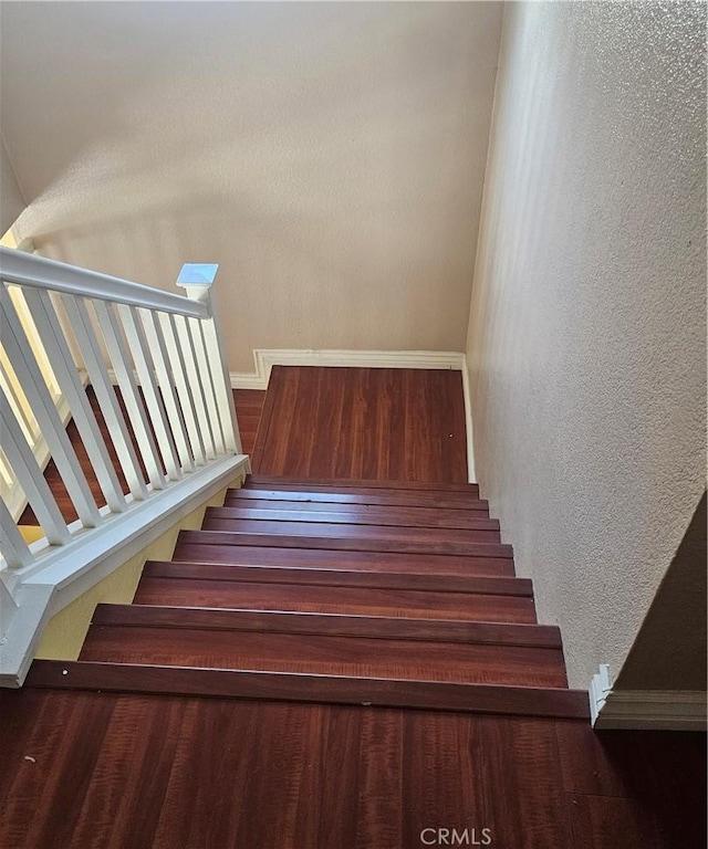 stairs with a textured wall