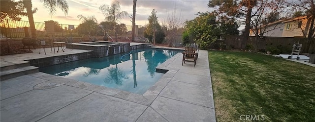 view of pool with a patio, a lawn, a fenced backyard, and a pool with connected hot tub