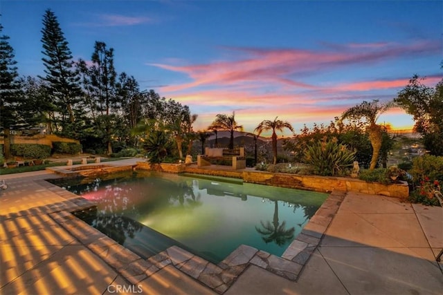 pool with a patio area