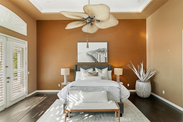 bedroom featuring access to exterior, baseboards, and dark wood-style flooring