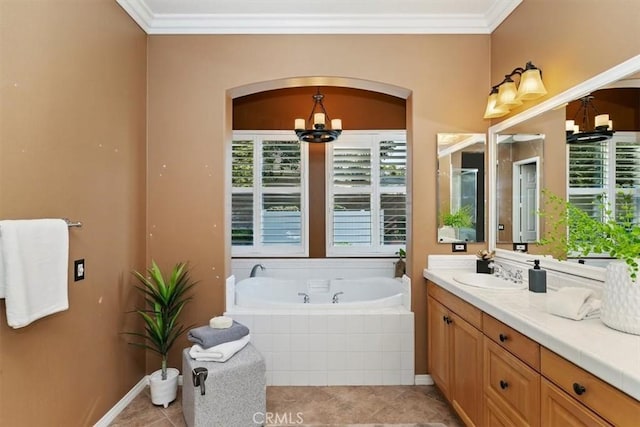 full bathroom with ornamental molding, a notable chandelier, vanity, and a bath