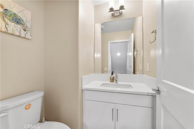 half bath with toilet and vanity