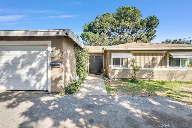 ranch-style home with stucco siding