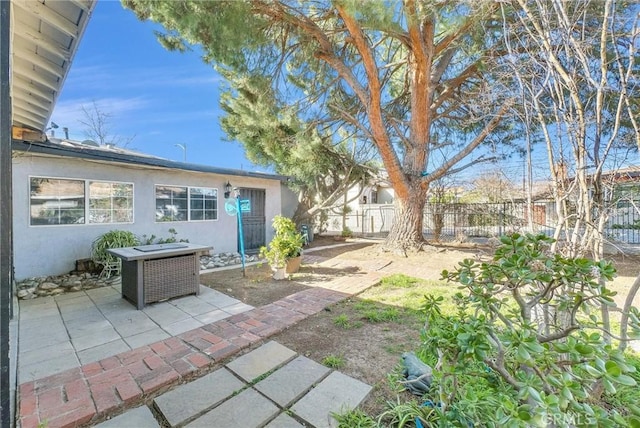 view of yard with a fenced backyard and a patio