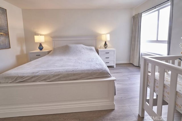 1617 S Beverly Glen Blvd Unit 303, Los Angeles, CA 90024 - bedroom featuring wood finished floors and baseboards