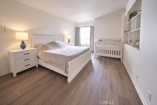 1617 S Beverly Glen Blvd Unit 303, Los Angeles, CA 90024 - bedroom with dark wood finished floors and baseboards