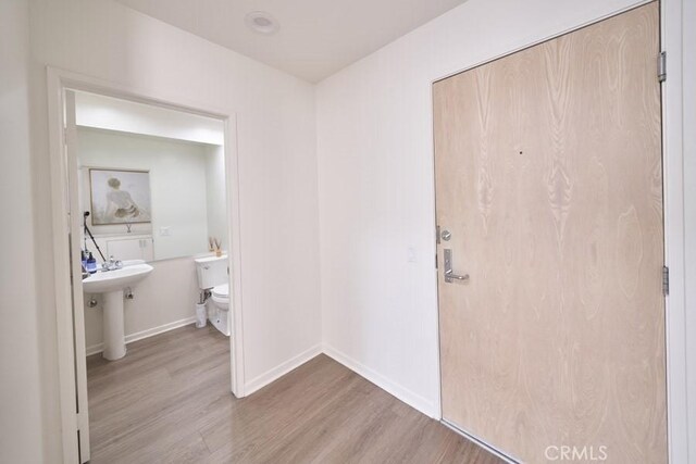 1617 S Beverly Glen Blvd Unit 303, Los Angeles, CA 90024 - entryway featuring wood finished floors and baseboards