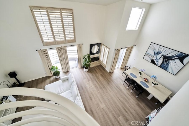 1617 S Beverly Glen Blvd Unit 303, Los Angeles, CA 90024 - living room with a towering ceiling and wood finished floors