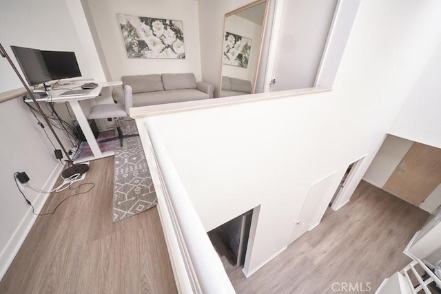 1617 S Beverly Glen Blvd Unit 303, Los Angeles, CA 90024 - living area featuring wood finished floors and a desk