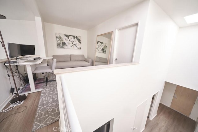 1617 S Beverly Glen Blvd Unit 303, Los Angeles, CA 90024 - interior space featuring wood finished floors, an office area, and a skylight