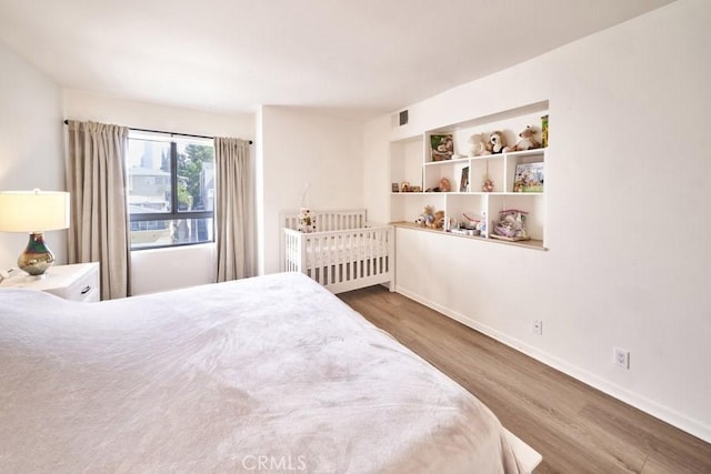 1617 S Beverly Glen Blvd Unit 303, Los Angeles, CA 90024 - bedroom featuring wood finished floors and baseboards