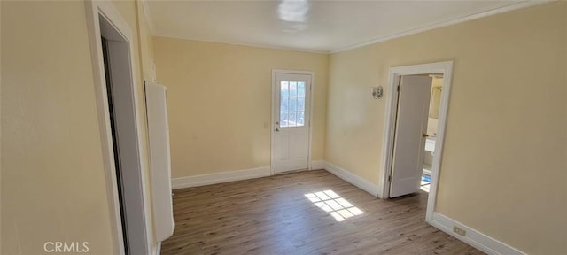 interior space with light wood finished floors and baseboards