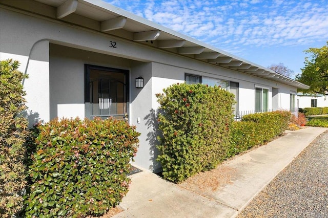 view of property exterior with stucco siding