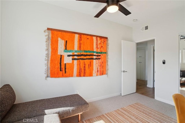 bedroom featuring a ceiling fan, carpet, visible vents, and baseboards