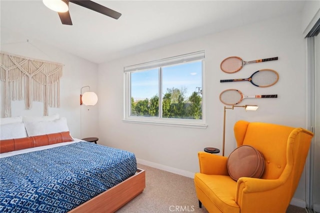 bedroom featuring carpet floors, baseboards, and a ceiling fan