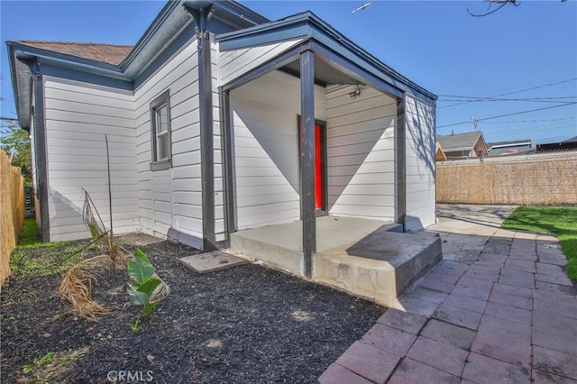 exterior space featuring a patio area and fence