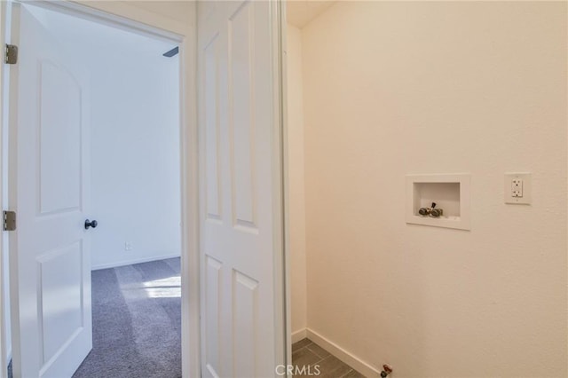 clothes washing area with laundry area, baseboards, washer hookup, and dark carpet